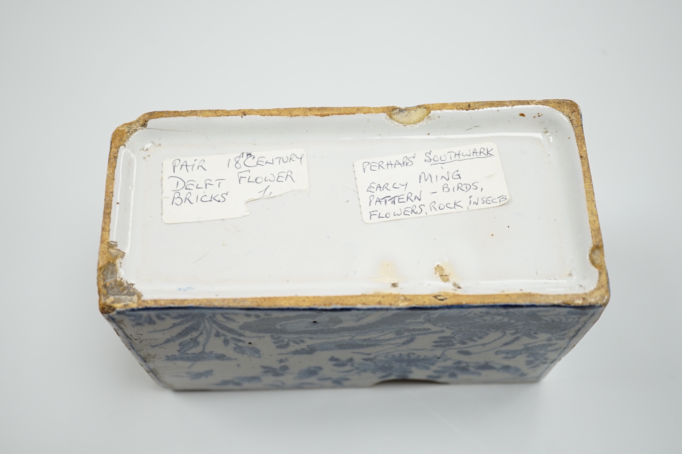A mid 18th century English delftware flower brick, probably Lambeth, painted in underglaze blue with a stylised pheasant and foliage, 15cm wide